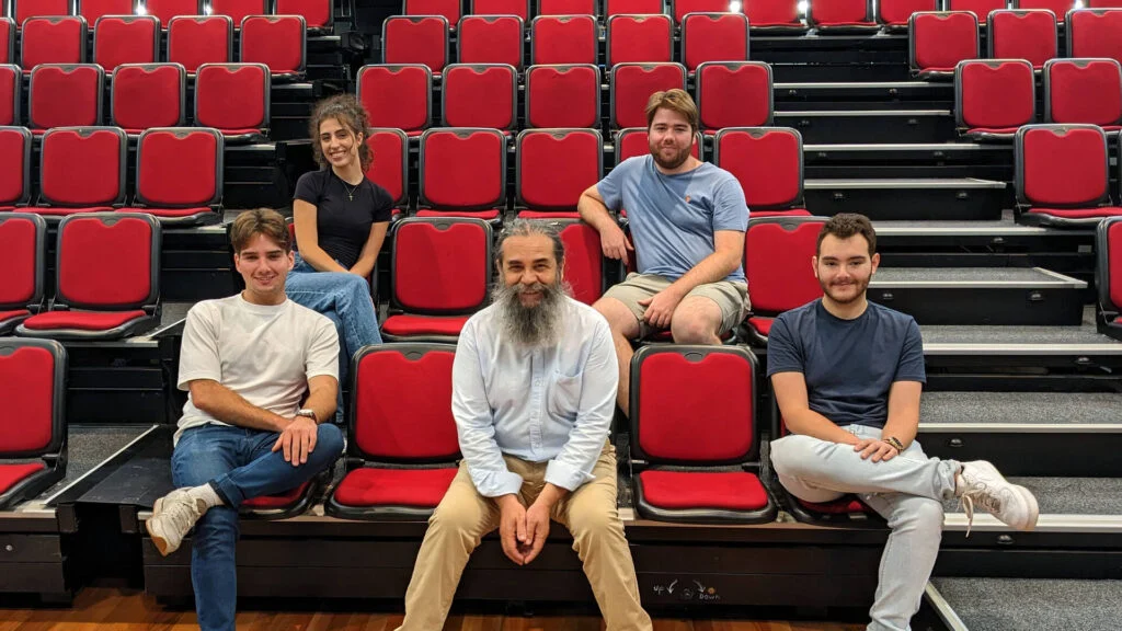 Dr Vassilis Adrahtas (centre) with UNSW students